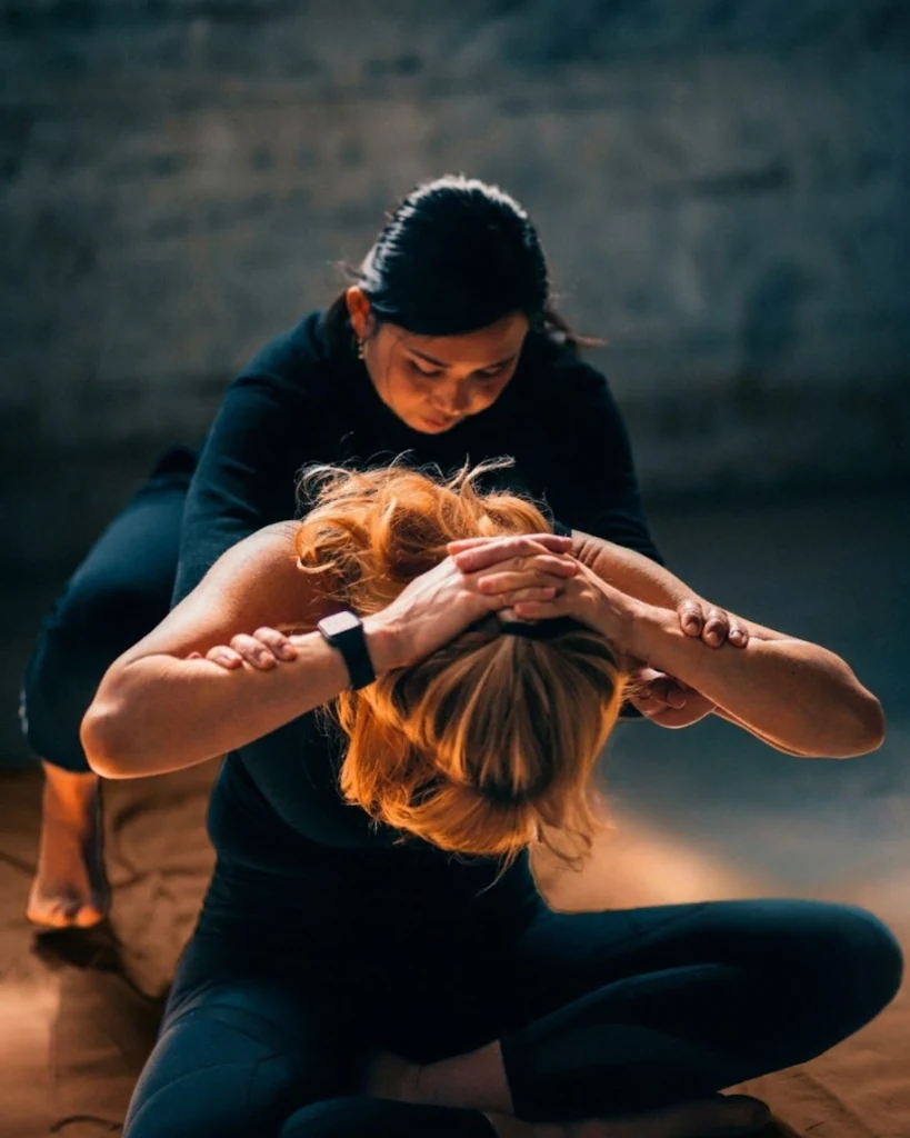 Controlled Thai Warrior assisted stretch with clear support and leverage