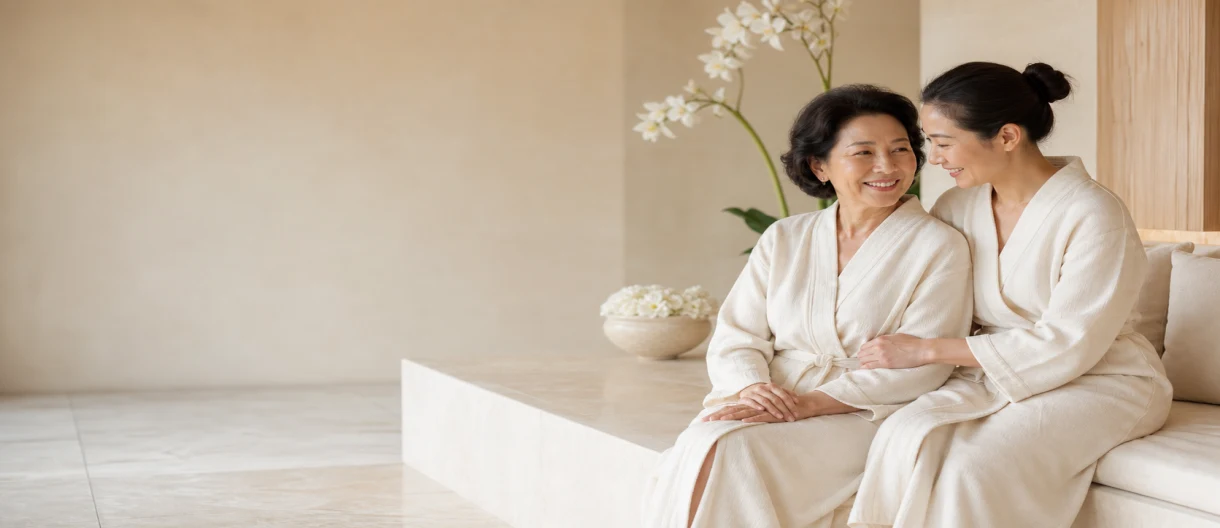 Thai mother and adult daughter sharing a warm moment in an elegant Bangkok spa setting