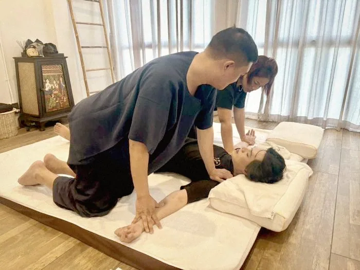 Hands-on Thai massage training with instructor guidance